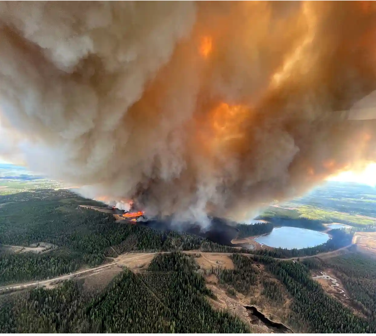 100+ Wildfires in Canada Displace Thousands